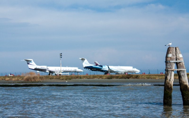 Two planes standing at Marco Polo airport Venice