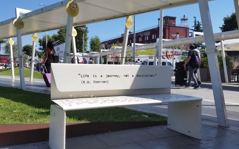 white bench at Naples international airport Italy