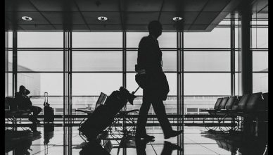 A man with his baggage at airport.