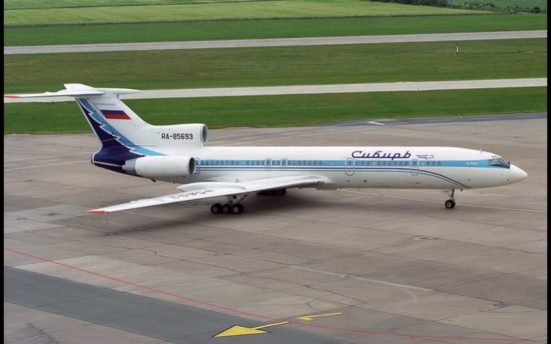 A white color plane standing at Hannover Airport