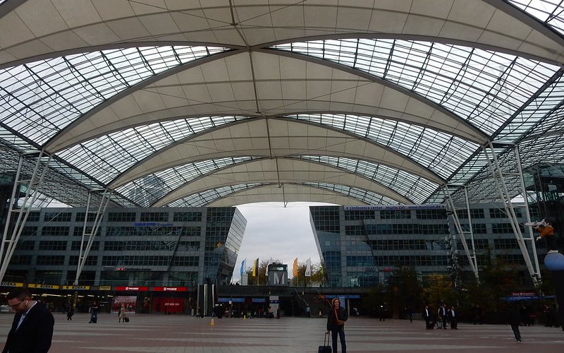 A man wearing black jacket at Munich Airport .