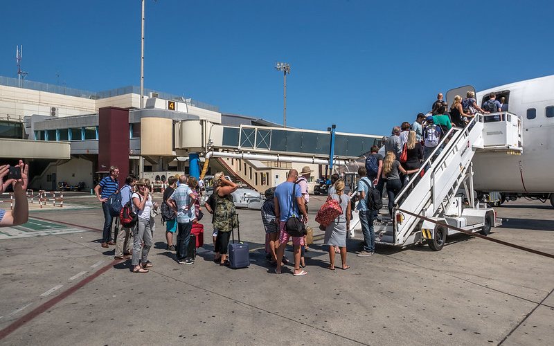 Passengers boarding on a flight.