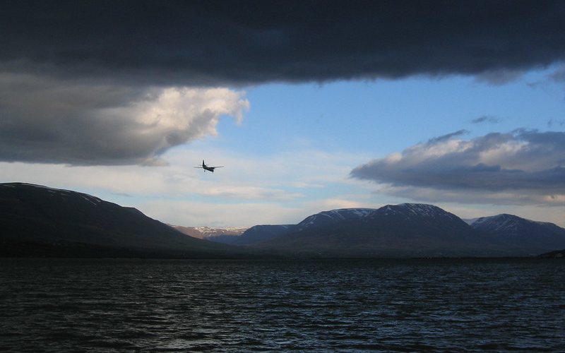  The plane coming in for landing at Akureyri with dark storm clouds