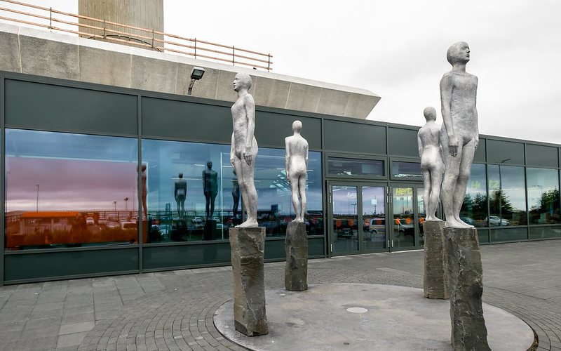 Outside area with grey Statues at Keflavik Airport.