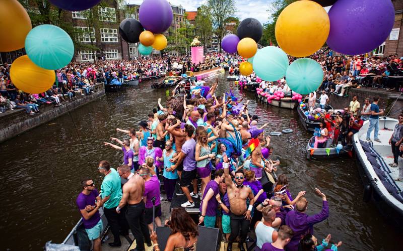 People enjoying on a boat at Canal Parade,Netherlands.