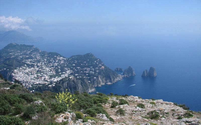 View of beautiful Capri island with small rock formation.