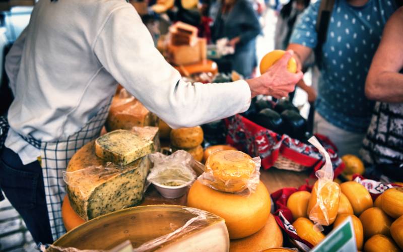 Man selling cheese at traditional market in Edam,Netherland