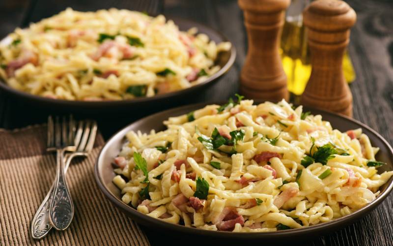 Spaetzle with bacon and onion, German style cuisine.