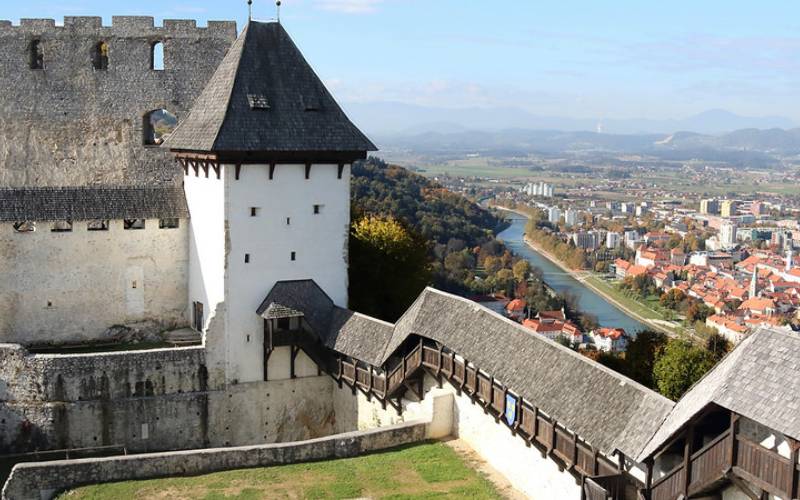 A white and grey color castle under the sky known as Celje Castle.