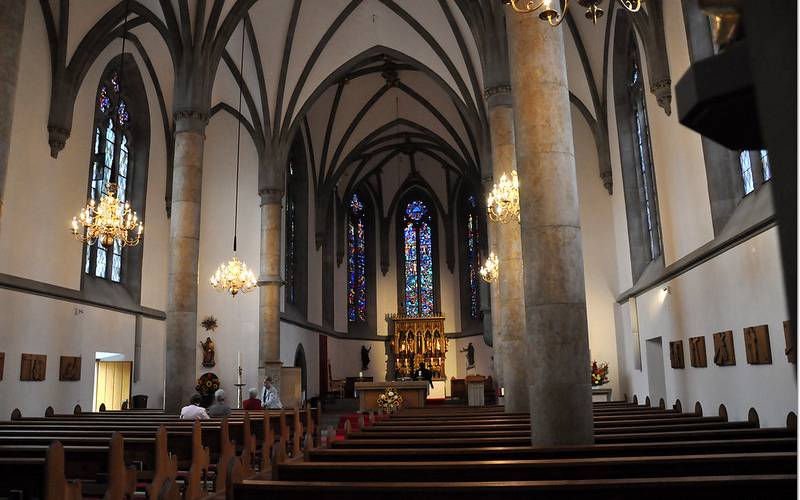 People offering payer at Kathedrale St. Florin. 