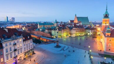 Beautiful buildings with lights during night in Poland.