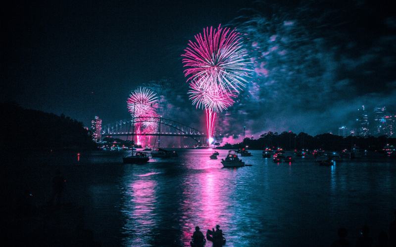 Blue and pink fireworks in the night sky for New Year in Stockholm Sweden