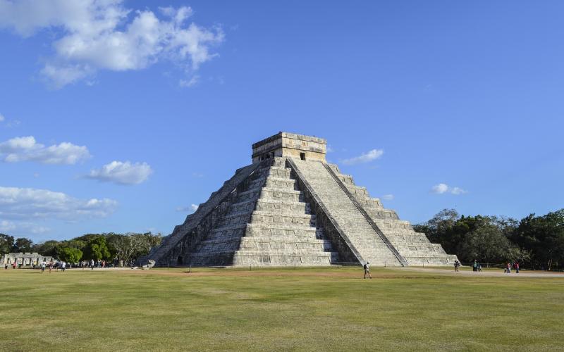 Ancient Chichen Itza pyramid in Mexico under a clear blue sky