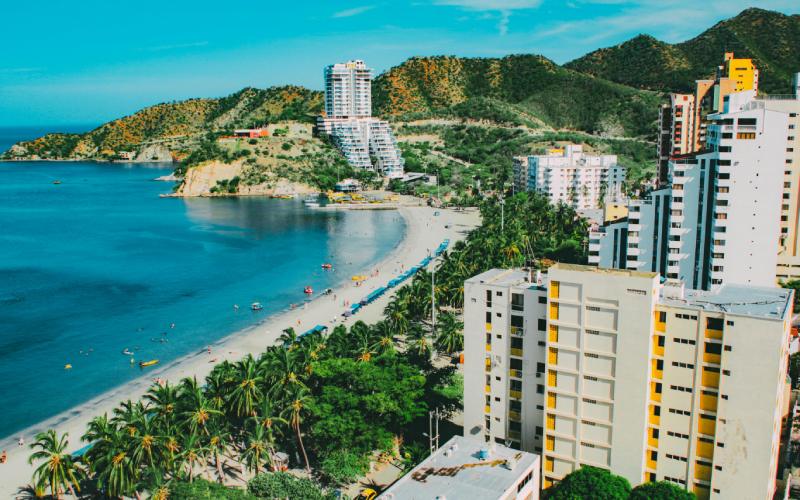 Scenic view of Santa Marta, Colombia with sea, buildings, and trees